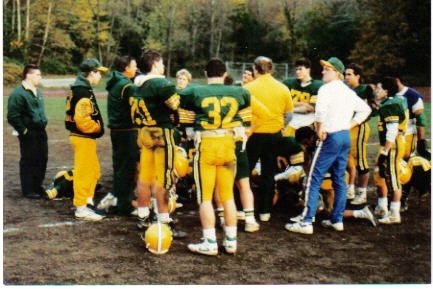 HHS Varsity Football on the sidelines.  Keith Fagan, HHS 1985, in street clothes.