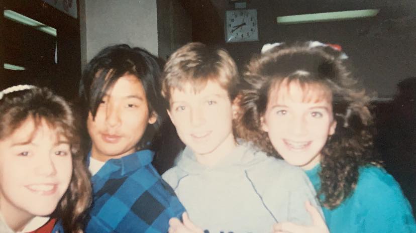 Four kids from the Class of 1993 when they were in about 8th grade.